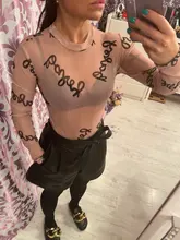 Verano de 2020 letra impresa Sexy transparente bodis de malla de manga larga ver a través de bebé Bodycon cortos mujeres monos