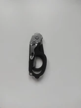 Tijeras de Respuesta de Emergencia Raptor 6 en 1, con cortador de Correa y interruptor de vidrio negro con funda Compatible con MOLLE