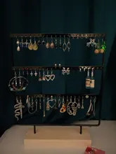 Soporte de exhibición para pendientes de tuerca de Metal con Base de madera, organizador de pendientes con 24/44/66 agujeros, venta al por mayor