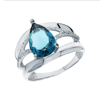 

Silver ring with cubic zirconia, London Topaz and jewelry glasses sunlight