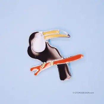 

Metal badge-bird Tukan on a branch (52076)