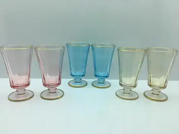 

Luster Colored Garnet Water Classes beside Coffee 6 Pieces