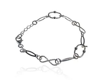 

Sterling silver bracelet with various openwork hoops and infinity-type loops