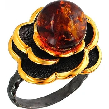 

Esthete ring with Amber made of black silver with gilding