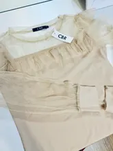 Blusa de manga larga ahuecada con volante elegante para otoño, camisa Sexy de malla transparente con cuentas y cuello redondo para mujer