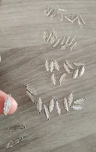 WYSIWYG 40 unids/lote pluma encantos colgante DIY joyería de Metal de Color de plata antiguo 15x5mm