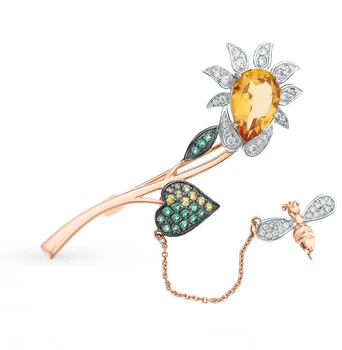 

Gold brooch with topaz, cubic zirconia and nano-spindles sunlight sample 585