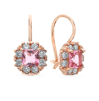 

Silver earrings with cubic zirconia and jewelry glasses sunlight sample 925 test
