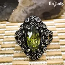 Серебряное кольцо из марказита с зеленым опалом