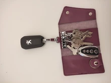 Billetera de cuero genuino de vaca para hombre y mujer, bolsa para llaves multifunción con hebilla de calidad a la moda, organizador de llaves con los titulares de ama de llaves