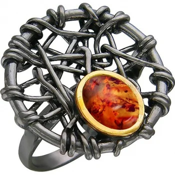 

Esthete ring with Amber made of black silver with gilding