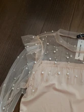 Blusa de manga larga ahuecada con volante elegante para otoño, camisa Sexy de malla transparente con cuentas y cuello redondo para mujer