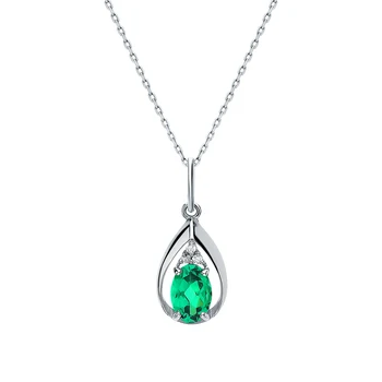 

Silver Pendant with cubic zirconia and emeralds synthetic sunlight
