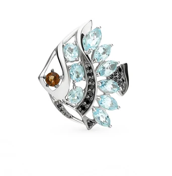 

Silver brooch with раухтопазами, topaz and cubic zirconia sunlight