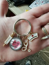 Estetoscopio de jeringa médica para enfermera, imagen creativa de llaveros de cristal en cabujón y cúpula de cristal, colgante de llavero, regalo, nueva moda