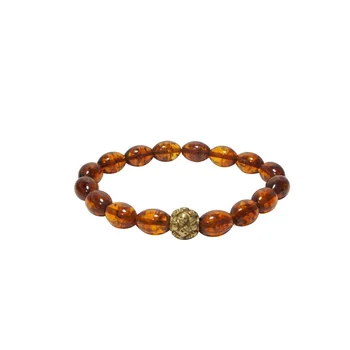 

Bracelet made of natural Baltic amber of cognac color with brass insert Georg Art