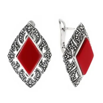 

Earrings made of silver with marcasite and coral imit.