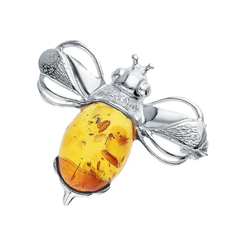 

Silver brooch with amber sunlight