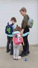 Mochila de grado alto para bebés y niñas, morral escolar 3D antipérdida con dibujos animados para guardería, impermeable de dinosaurios