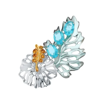 

Silver brooch with cubic zirconia and tourmaline imitation sunlight sample 925