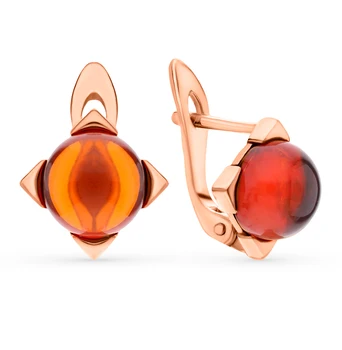 

Gold earrings with amber sunlight