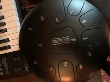 Tambor de Lengua de Acero 12 Pulgadas 13 Notas Tambor Metálico de Lengüetas Acero Handpan Drum con 13 Teclas de Notas con Bolsa Libro de Música Mazos Puntas de Dedo