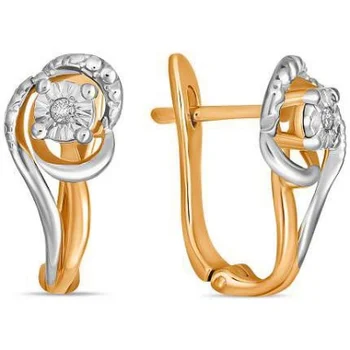 

Lucas gold earrings with 2 red gold diamonds