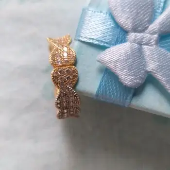 

Golden Ring 18 k with stones zircon